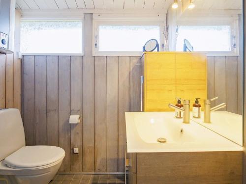 a bathroom with a sink and a toilet at Holiday home Karrebæksminde VI in Karrebæksminde