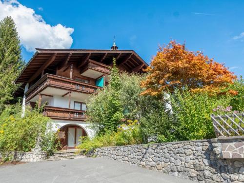 a house on a hill with a stone wall at Hochkönig in Kirchberg in Tirol