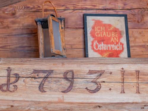 a sign that says letuce an originalsiction on a wood wall at Hochkönig in Kirchberg in Tirol