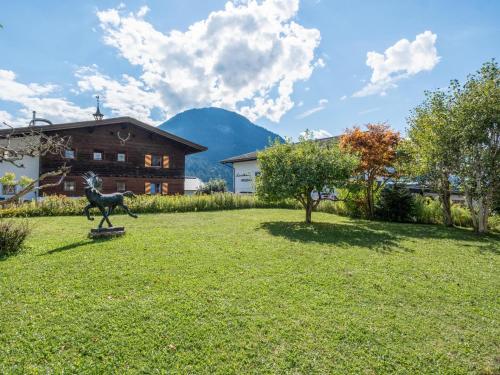 a statue of a horse in the middle of a yard at Hochkönig in Kirchberg in Tirol