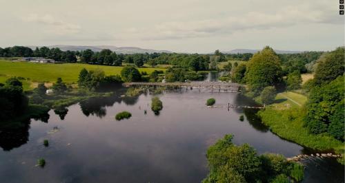 an aerial view of a river with a bridge at Kingfisher Lodge & Pub in Castleconnell