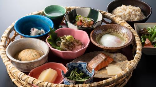 a basket filled with different types of food at Satoyama Auberge & Hot Spring Wellness Spa Sakuragaike Kurgarden in Nanto