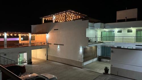 a large building with lights on top of it at night at CASA BRAVO in Huamantla