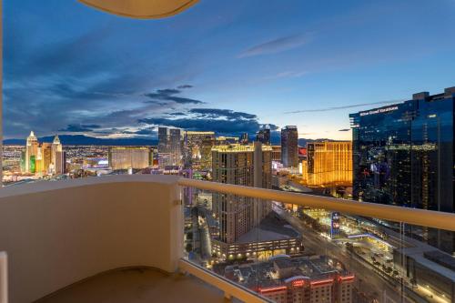 a view of a city skyline at night at Lucky Gem Penthouse Suite MGM Signature, Balcony Strip View 3505 in Las Vegas
