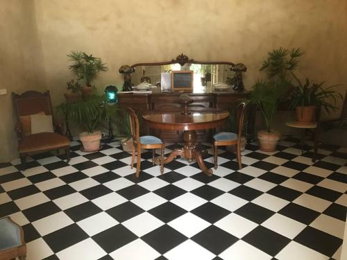 an office with a desk and a computer on a checkered floor at Strawbale House Bacchus Marsh in Bacchus Marsh
