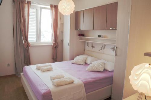 Säng eller sängar i ett rum på Apartment Luna & Lea