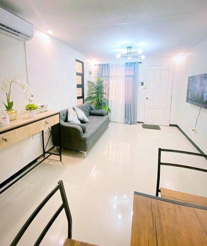 a living room with a couch and a table at Sönmez Private Villa in Cavite
