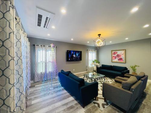 a living room with two couches and a tv at Green Lake 1st Line Home A with Central Air Conditioners in Seattle