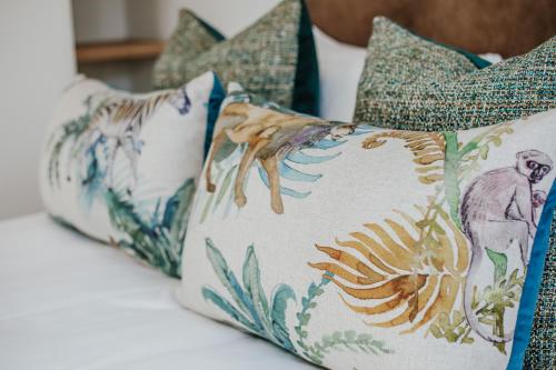 a row of pillows sitting on top of a table at Quiet Hideaway in Somerset West