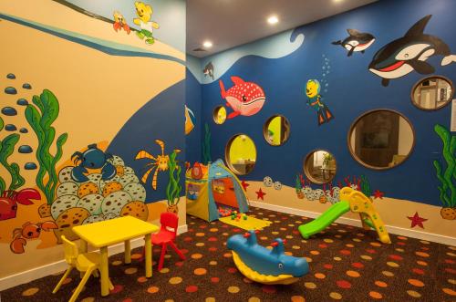 a childs room with a play area with ayden at Somerset Central TD Hai Phong City in Hai Phong