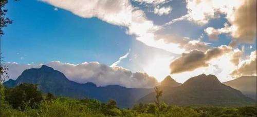 a view of the mountains with a cloudy sky at Abimansala Resort in Hunnasgiriya