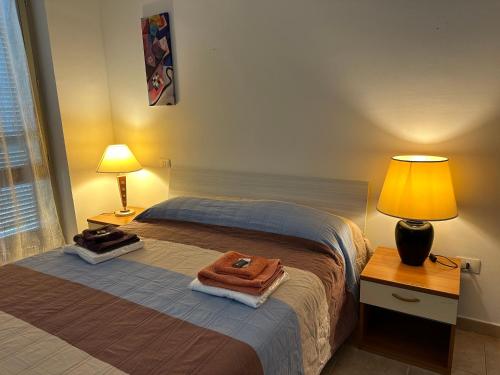 Postel nebo postele na pokoji v ubytování Casa vacanze Giuliani via Rasiglia
