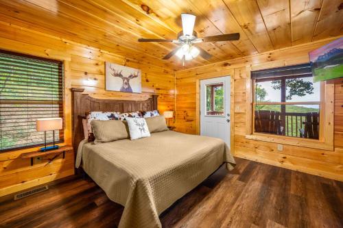 a bedroom with a bed and a ceiling fan at Heavenly Heights by Ghosal Luxury Lodging in Sevierville