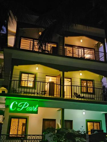 a building with a sign that reads c park at C Pearl in Majorda