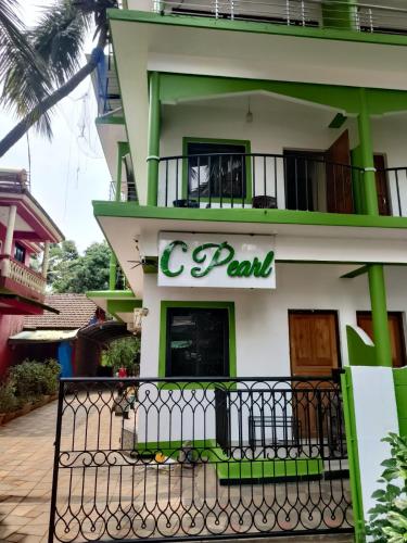 a building with a c park sign on it at C Pearl in Majorda