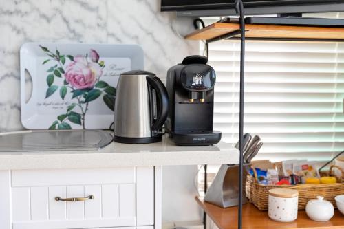 a coffee maker on a counter in a kitchen at Million Dollar Views in Hobart
