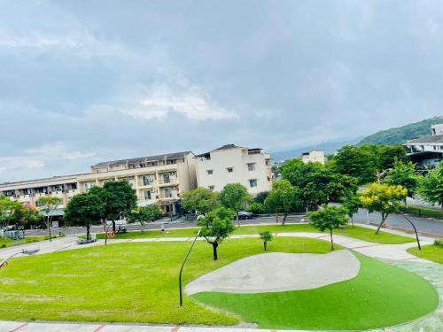 a golf course in the middle of a park at Jiu Xingji in Dayin