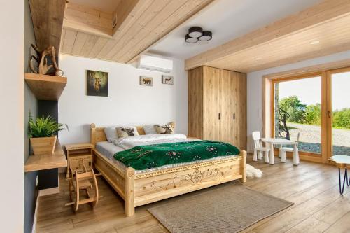 Ένα ή περισσότερα κρεβάτια σε δωμάτιο στο Rogata Chata Premium, Kościelisko