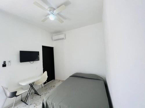 Ένα ή περισσότερα κρεβάτια σε δωμάτιο στο Mini Departamento Real del Country Playa Alberca