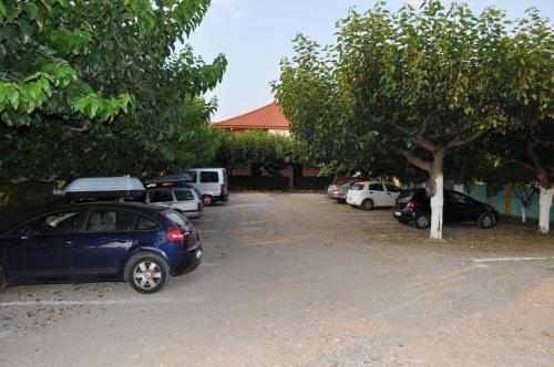 a bunch of cars parked in a parking lot at Olympion Village Studios in Zakharo