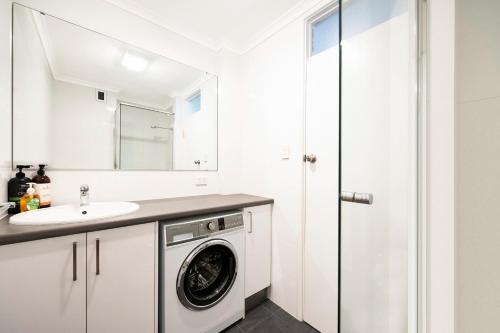 A bathroom at The Allegra - 180 degree ocean and city views