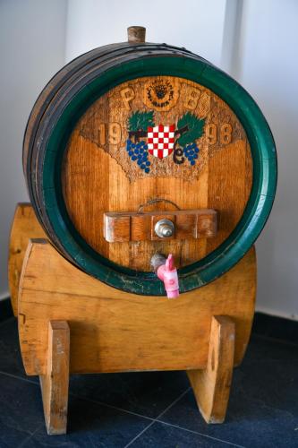 a wooden ottoman with a wheel on top of it at Holiday Home BIBA With Heated Outdoor Pool in Gornja Stubica
