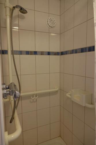 a bathroom with a shower with a glass door at kaulbach5 in Bad Arolsen