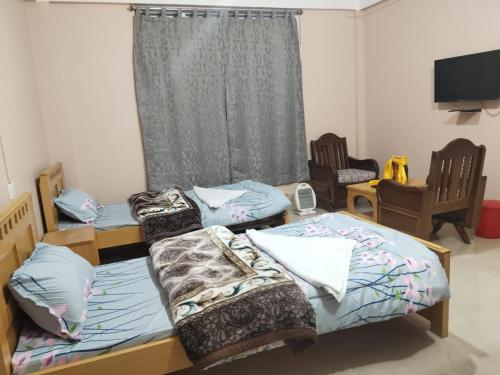 Una cama o camas en una habitación de The Himalayan Nest