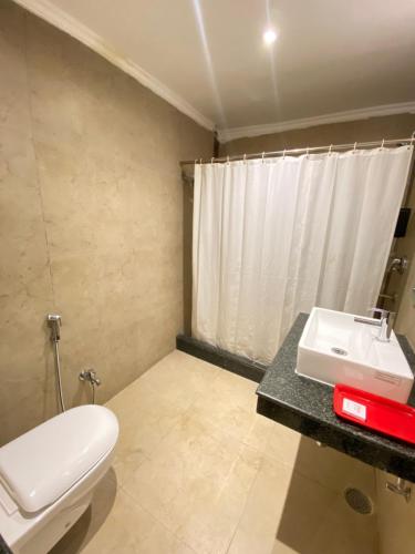 Ένα μπάνιο στο Status Business Hotel - Naveen Market
