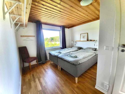 Posteľ alebo postele v izbe v ubytovaní Comfortable guest rooms with fully equipped kitchen and cosy living room.