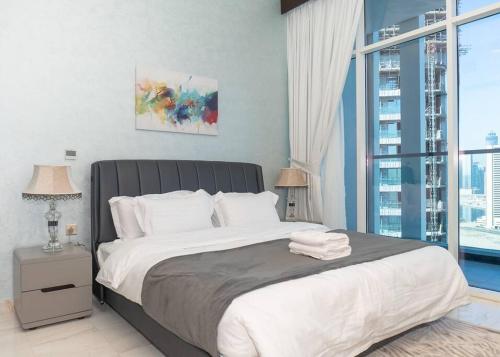Postel nebo postele na pokoji v ubytování StoneTree - Modern 1BR in Business Bay