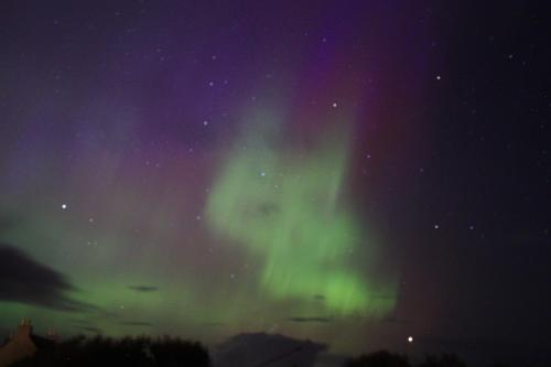 an image of the northern lights in the sky at Snowberry Cottage in Borve