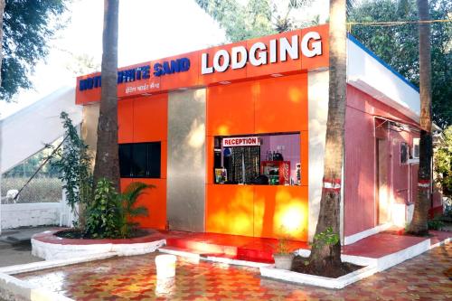 a store with a red and orange building at White Sand Resort Manori Mumbai Malad West in Mumbai