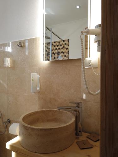 a bathroom with a sink with a tub in it at Transylvanian Views in Peştera