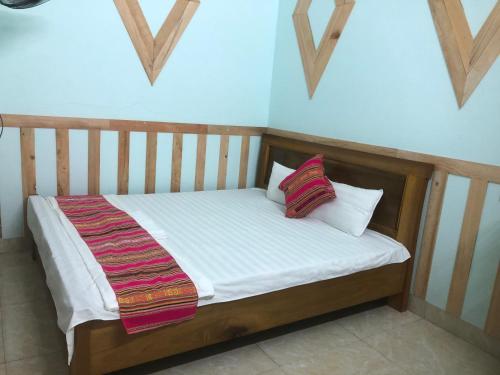 מיטה או מיטות בחדר ב-Homestay Hải Long