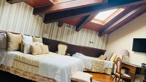 a bedroom with a large bed and a couch at Hotel Dei Pittori in Turin
