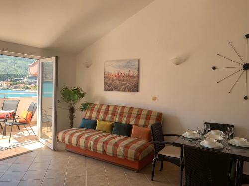 a living room with a couch and a table at Daniel in Igalo