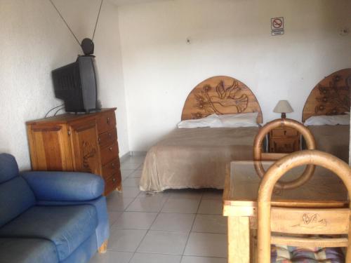 Cama o camas de una habitación en Hotel Colibri Queretaro