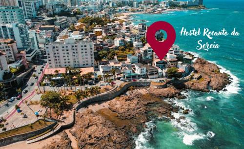 an aerial view of a city with a red marker at Hostel Recanto da Sereia in Salvador