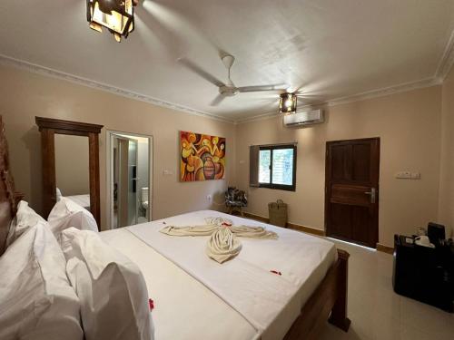 Voodi või voodid majutusasutuse Shivo Guest House toas