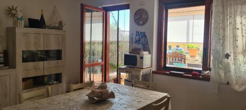 TV a/nebo společenská místnost v ubytování villetta giulia fronte mare