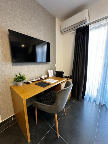 an office with a desk with a monitor and a chair at La Vista Luxury Villa in Ohrid