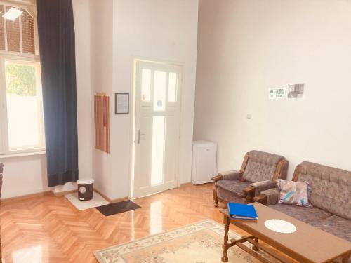 a living room with a couch and a table at Eldorado in Sombor