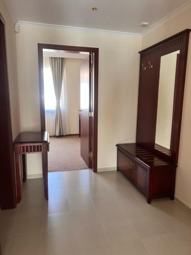 a room with a dressing table and a mirror at Next to the Ski Lift Downtown Bansko in Bansko