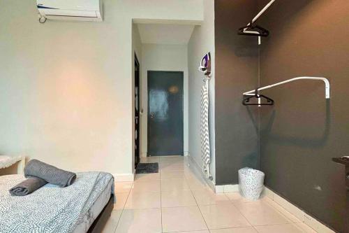 a room with a bed and a shower in it at Moderm Spacious 6pax S PICE Penang in Bayan Lepas