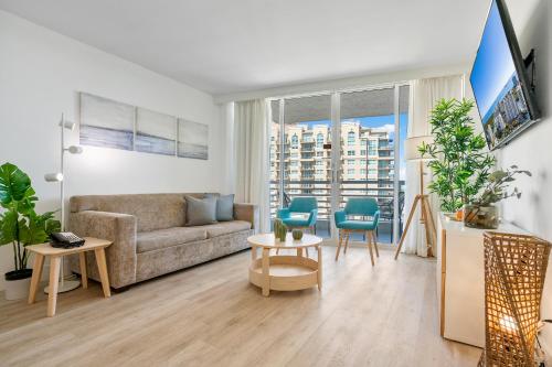 a living room with a couch and a table at Avi Lux Stay in Fort Lauderdale