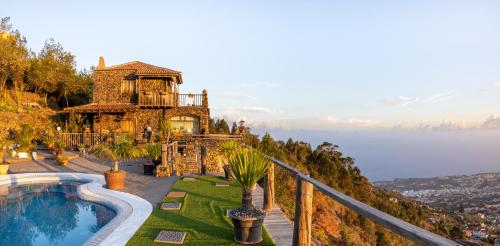 A view of the pool at CASA RURAL LA PERLA NEGRA or nearby