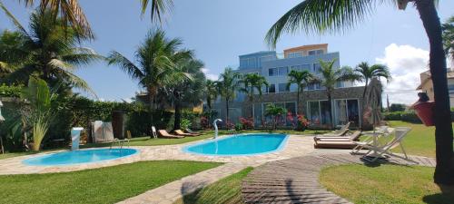 Piscina de la sau aproape de Loft e Flats Beira Mar - Apart Hotel Praia dos Carneiros
