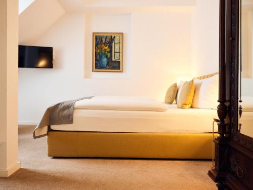 Postel nebo postele na pokoji v ubytování Hotel Lindenufer