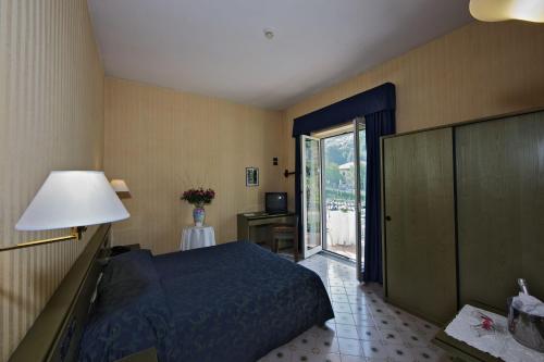 Llit o llits en una habitació de Hotel Parco